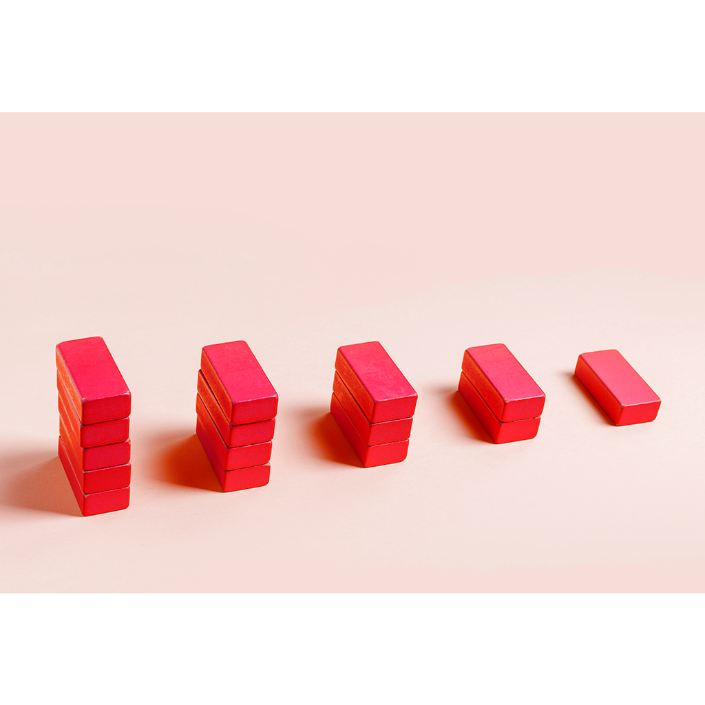 Five stacks of red blocks, going from left to right in descending height order Five stacks of red blocks, going from left to right in descending height order