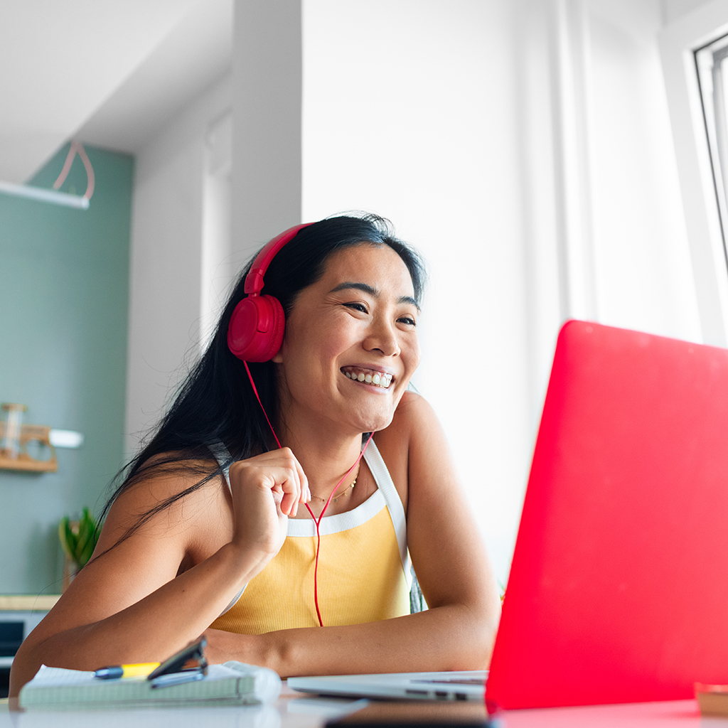 women on laptop with headphones women on laptop with headphones