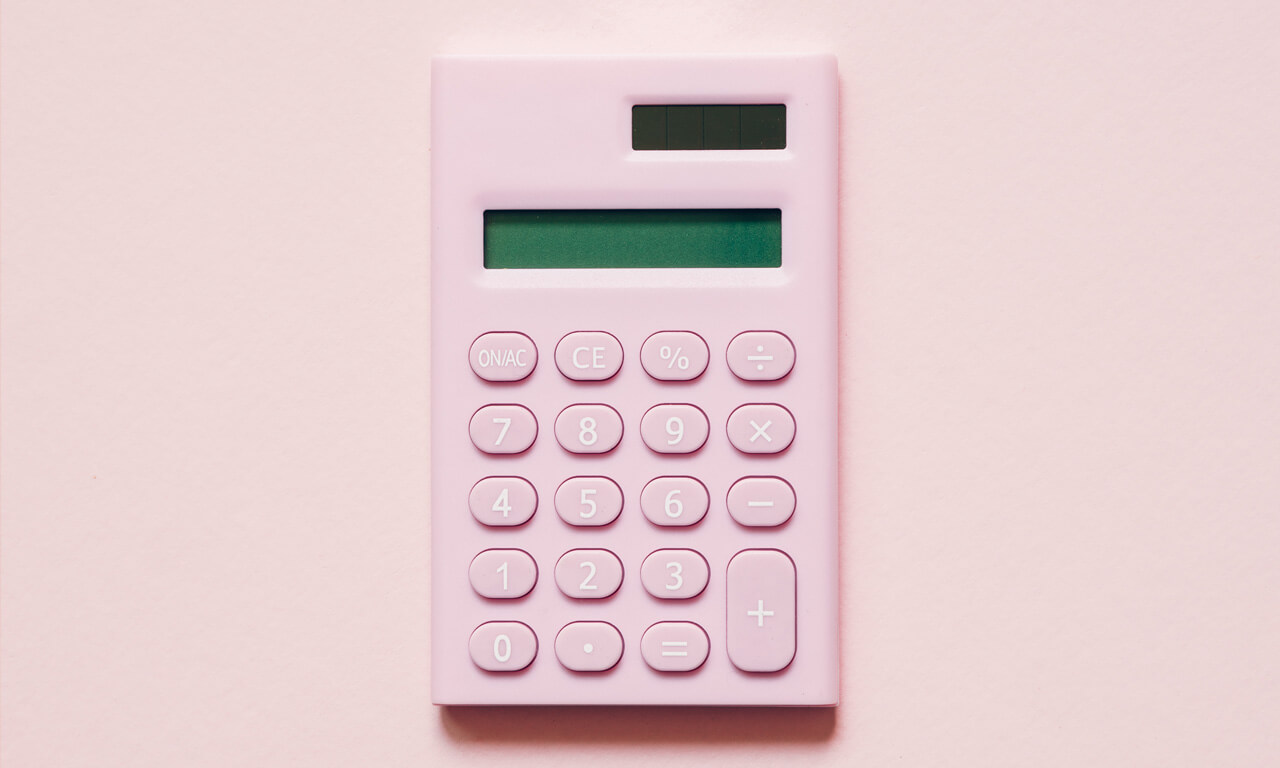 Pink calculator on pink background